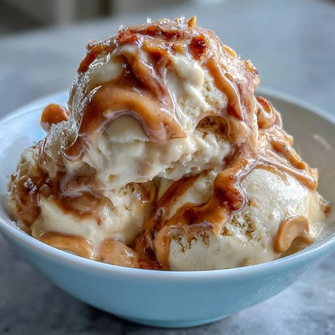Creamy peanut butter banana ice cream made with ripe frozen bananas and natural peanut butter. A healthy, dairy-free dessert perfect for hot summer days.