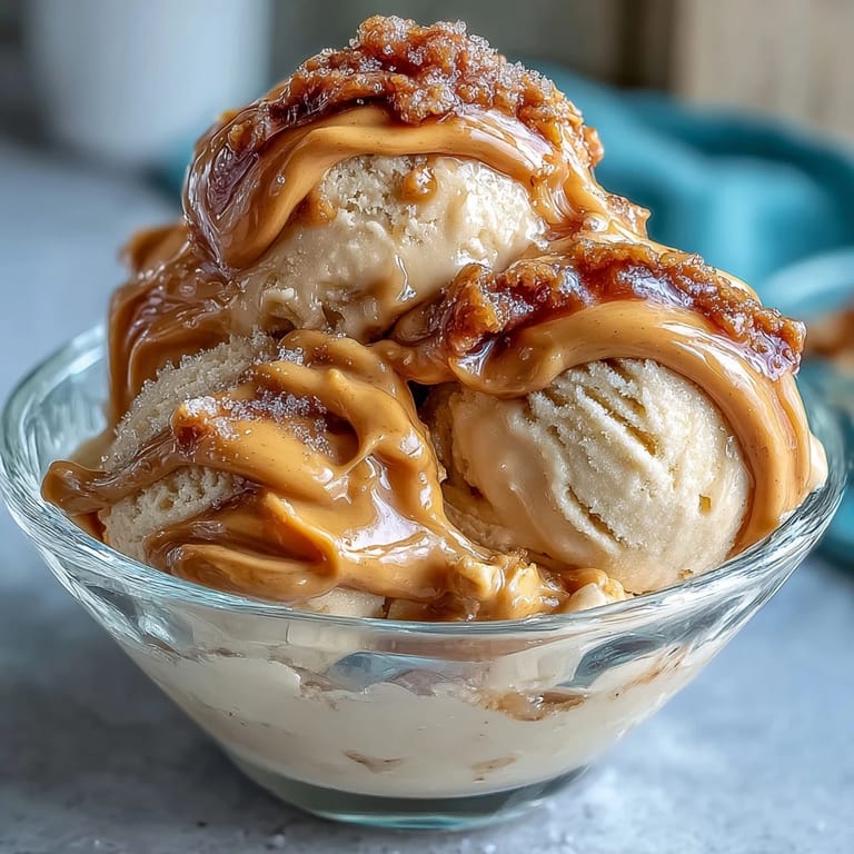 Four-ingredient peanut butter banana ice cream with swirls of creamy peanut butter and sweet frozen bananas. An easy vegan treat ready in minutes.